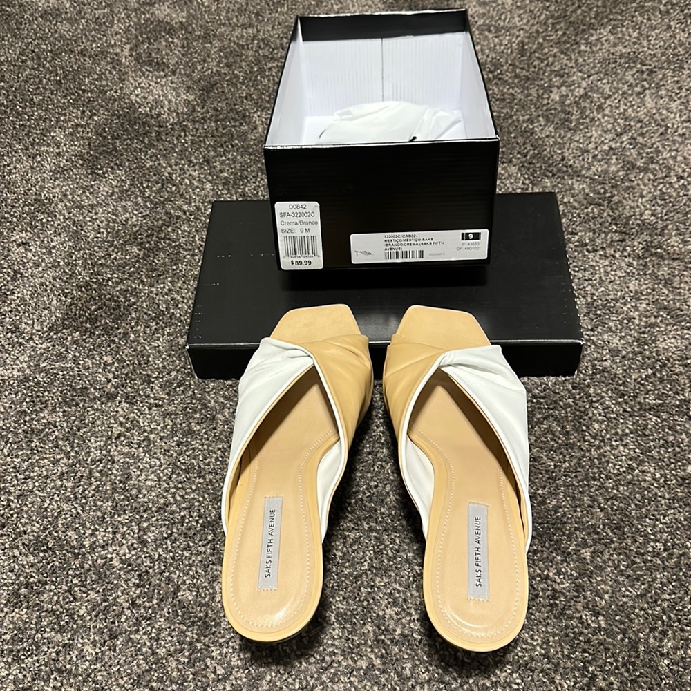 Cream sandals with kitten heel.